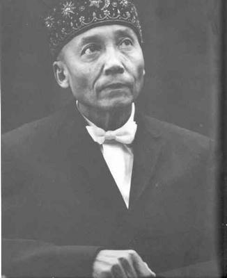 Portrait of Elijah Muhammad sitting