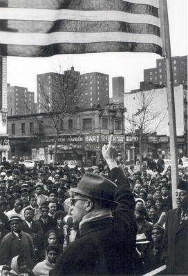 Malcolm addressing a rally in Harlem.