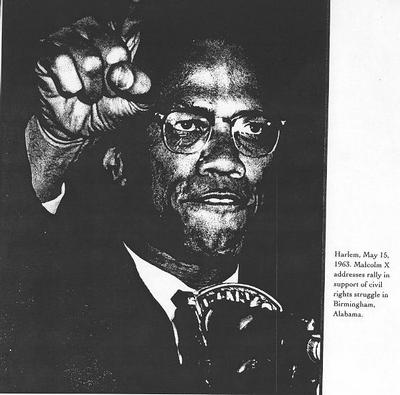 Malcolm at the microphone during a speech in Harlem in support of the Birmingham civil rights struggle.