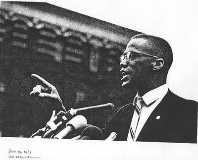 Malcolm speaks at a rally in Harlem