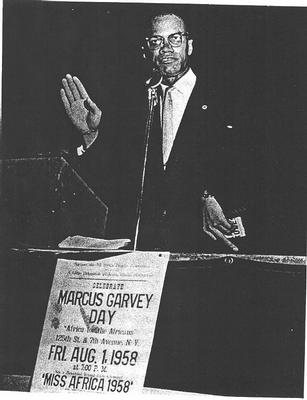 Malcolm speaks before the Marcus Garvey Day celebration in Harlem.